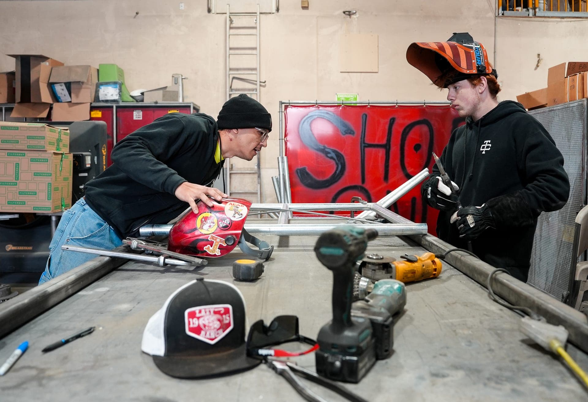 Students fabricating metal in a workshop